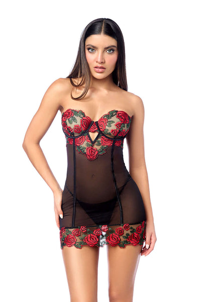 Woman wearing a black lingerie set with red floral detail