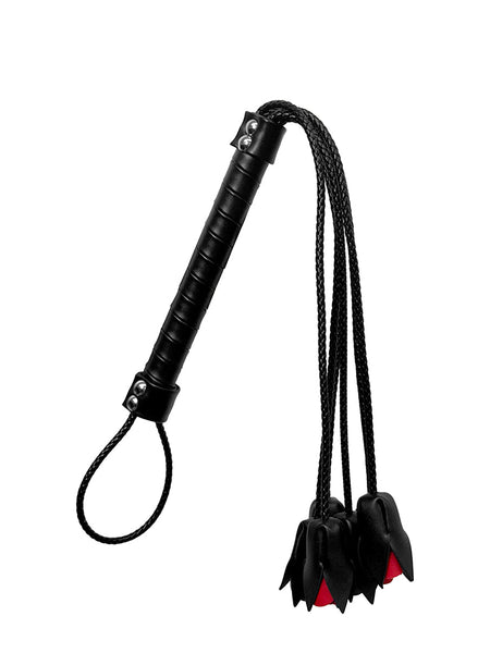 Black leather whip with red rose accents, lingerie accessory