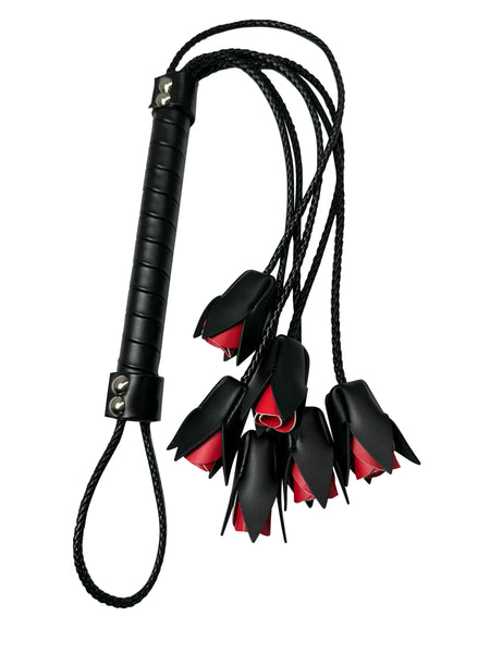 Black leather whip with red rose accents, lingerie accessory